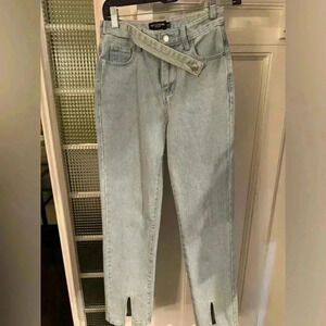 Pretty Little Thing high waist boot cut jeans. Front cross over strap